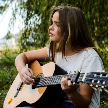 girl playing guitar